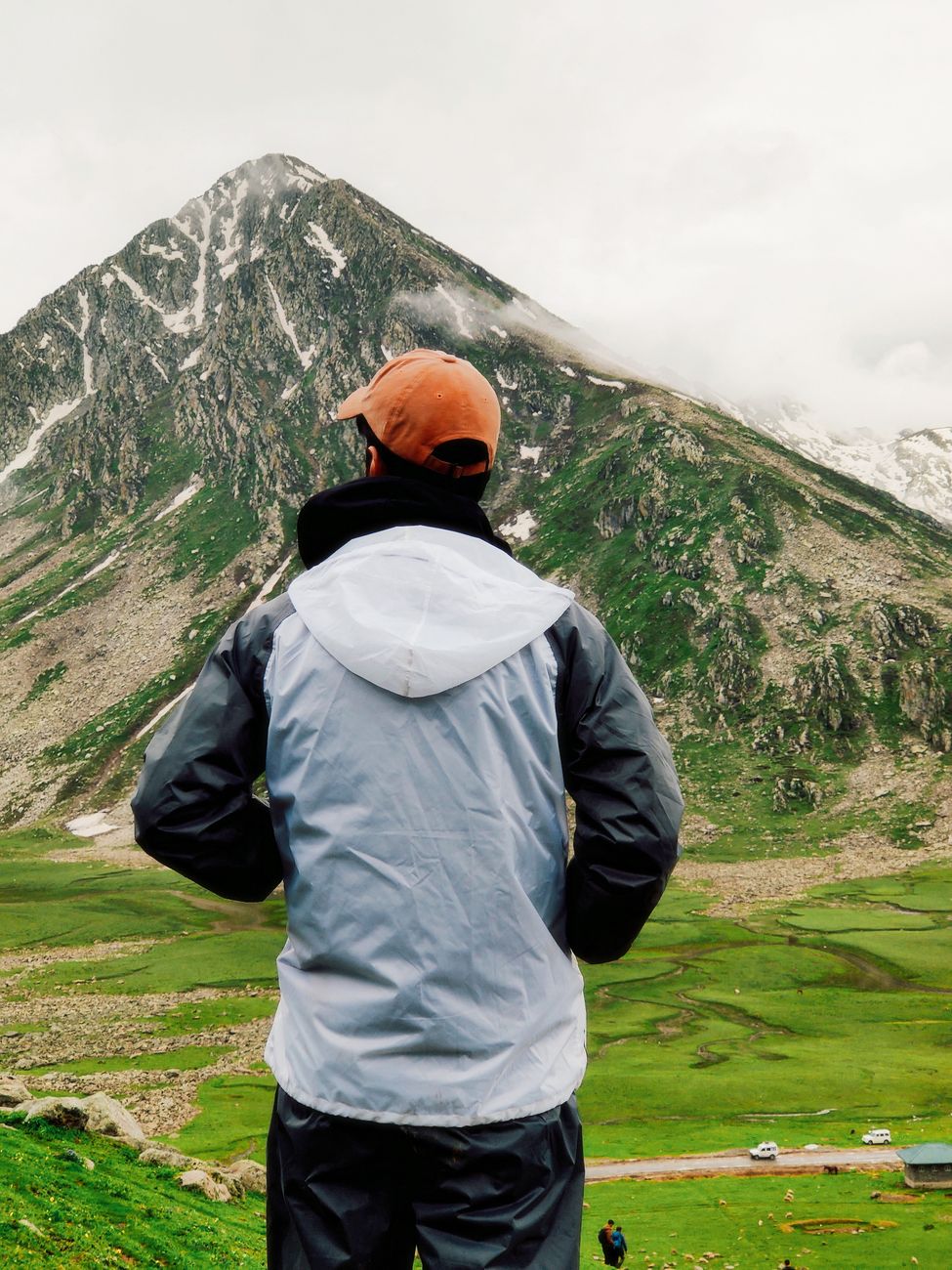 Traveler looking out toward mountain ridgelines