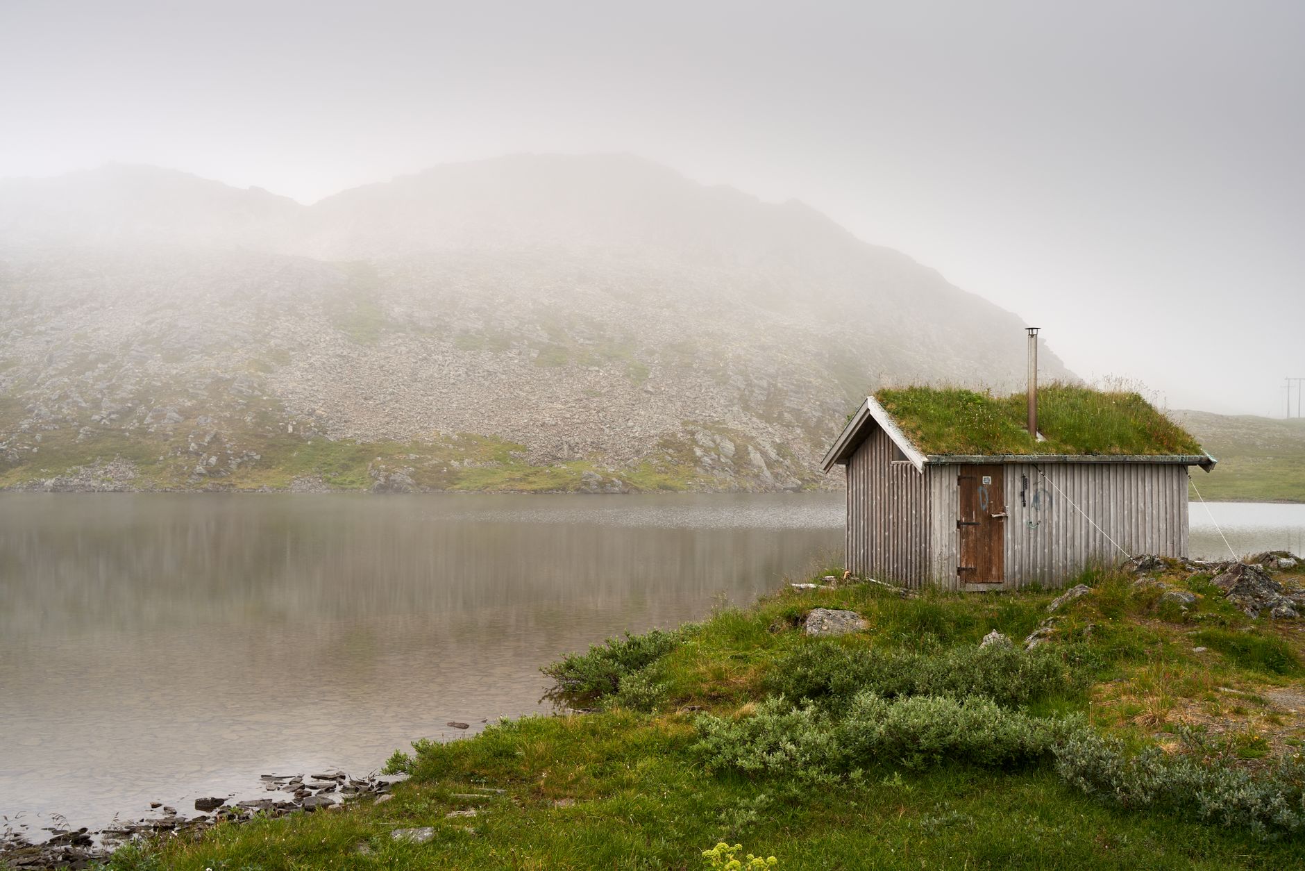 Nordic fjord and modern wooden sauna